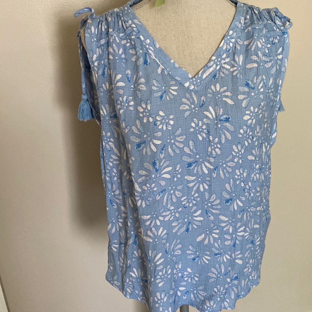 Blue floral sleeveless top with shoulder accents